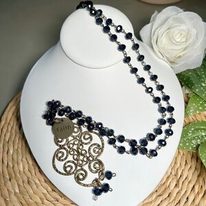 Mac and Me necklace features a beautiful filigreed hammered brass pendant